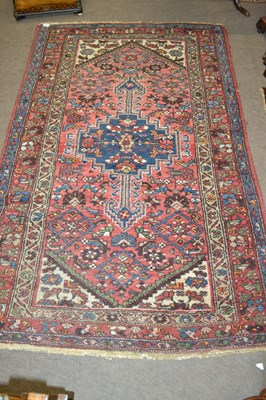 Lot 568 - A Turkish wool rug decorated with a large...
