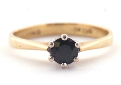 Lot 32 - A single stone sapphire ring, the round...