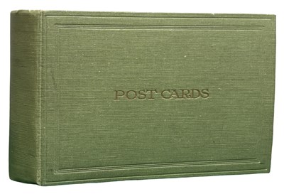 Lot 1107 - An album of postcards, which includes examples...