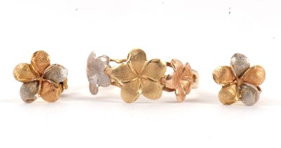 Lot 112 - An 18ct flower ring and matching earrings, the...