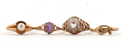 Lot 82 - Four rings: to include a cultured pearl ring...