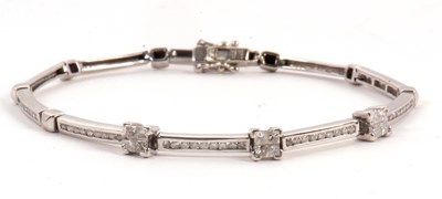 Lot 118 - A 9ct diamond bracelet, set with three squares...