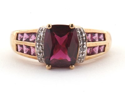 Lot 81 - A 9ct rhodolite garnet and diamond ring, the...