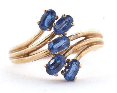 Lot 75 - A 9ct blue stone ring, set with five oval blue...