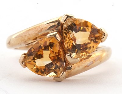 Lot 73 - A 9ct citrine ring, set with two trillion cut...