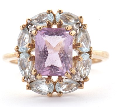 Lot 80 - A 9ct amethyst, topaz and diamond ring, the...