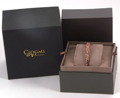 Lot 160 - A Clogau bangle, the silver and rose gold...