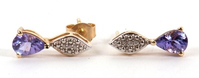 Lot 133 - A pair of tanzanite and diamond earrings, the...