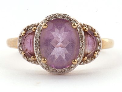 Lot 45 - A 9ct amethyst and diamond ring, the three...