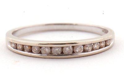 Lot 72 - An 18ct white gold diamond ring, the half hoop...