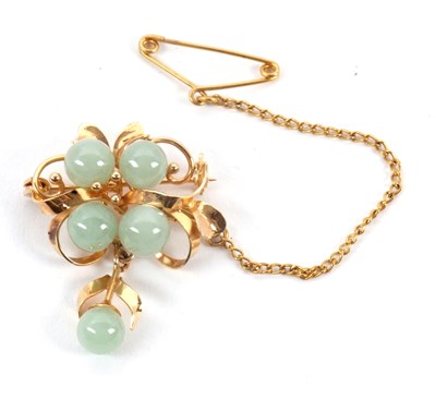 Lot 99 - A jade brooch, modelled as a stylised bunch of...