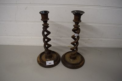 Lot 103 - PAIR OF WOODEN BARLEY TWIST CANDLESTICKS