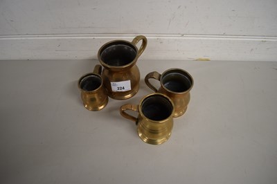 Lot 224 - FOUR SMALL BRASS MEASURES