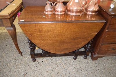 Lot 395 - 20TH CENTURY OAK OVAL DROP LEAF DINING TABLE...