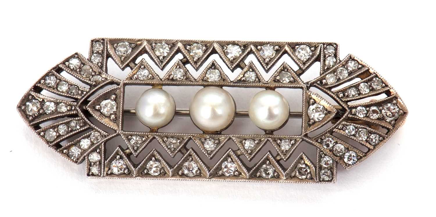 Lot 80 - An Art Deco diamond brooch, set to centre with...