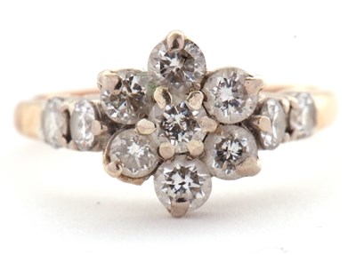 Lot 26 - A diamond cluster ring, the flowerhead cluster...