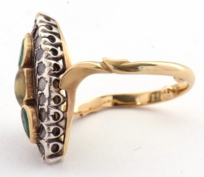 Lot 21 - A marquise shape emerald and diamond ring, set...