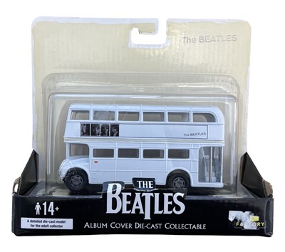Lot 129 - A boxed Beatles die-cast model bus, promoting...
