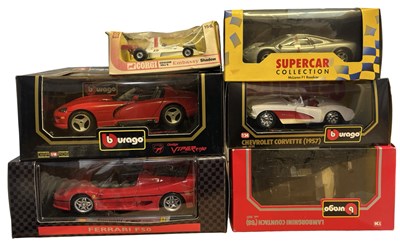Lot 157 - A collection of various boxed racing cars, to...