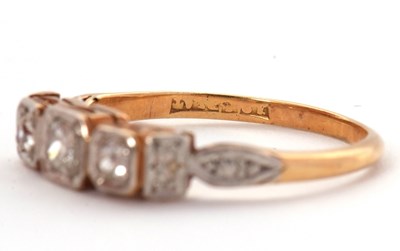 Lot 17 - A three stone diamond ring, the three slightly...