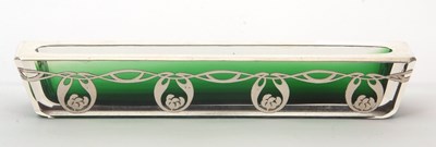Lot 54 - An Art Nouveau green glass and white metal...