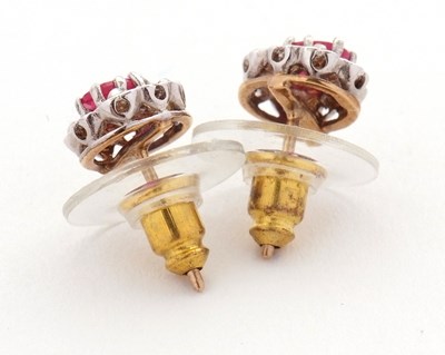 Lot 91 - A pair of ruby and diamond cluster earrings,...