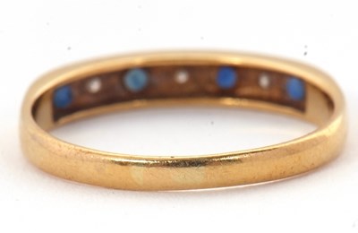 Lot 9 - A 18ct sapphire and diamond ring, with...