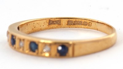 Lot 9 - A 18ct sapphire and diamond ring, with...