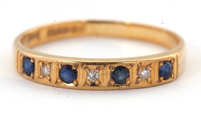 Lot 9 - A 18ct sapphire and diamond ring, with...