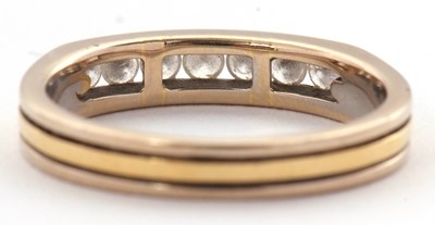 Lot 31 - A seven stone diamond ring, with channel set...