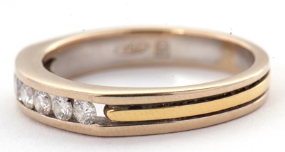 Lot 31 - A seven stone diamond ring, with channel set...