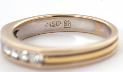 Lot 31 - A seven stone diamond ring, with channel set...