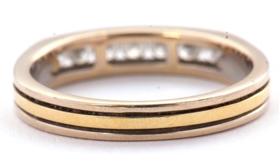 Lot 31 - A seven stone diamond ring, with channel set...