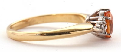 Lot 29 - An 18ct orange stone and diamond ring, the...