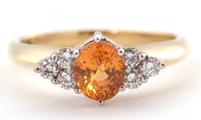 Lot 29 - An 18ct orange stone and diamond ring, the...