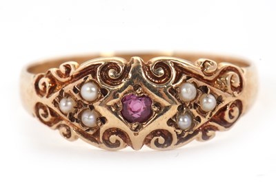 Lot 13 - A 9ct ruby and seed pearl ring, with a central...