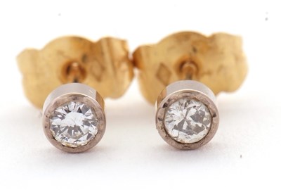 Lot 93 - A pair of unmarked diamond earstuds, each...
