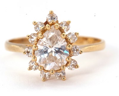 Lot 54 - A 14ct CZ ring, set with a pear shape cluster...