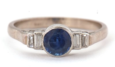 Lot 66 - An 18ct and platinum sapphire and diamond ring,...