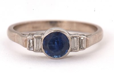 Lot 66 - An 18ct and platinum sapphire and diamond ring,...