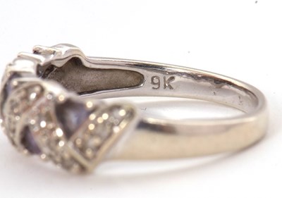 Lot 61 - A 9ct diamond and tanzanite ring, set with...
