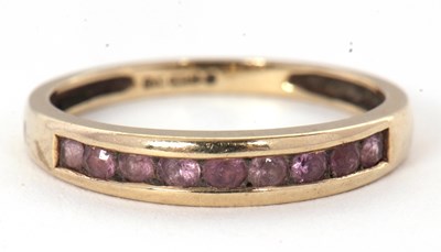 Lot 58 - A 9ct gemset ring, with channel set small...