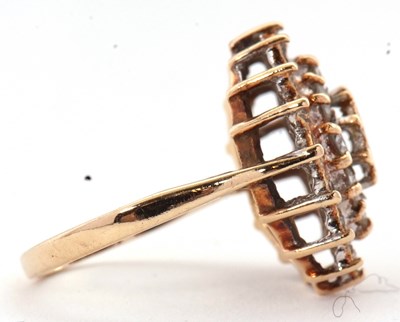 Lot 70 - A 9ct diamond cluster ring, set with round...