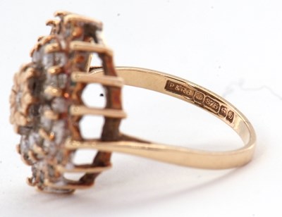 Lot 70 - A 9ct diamond cluster ring, set with round...
