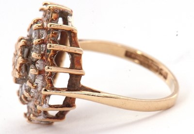 Lot 70 - A 9ct diamond cluster ring, set with round...