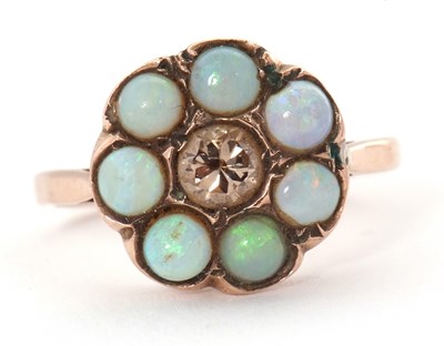 Lot 71 - An opal and diamond ring, the central round...
