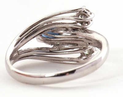 Lot 42 - A sapphire and diamond ring, set with an oval...