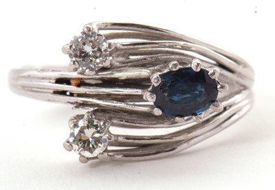 Lot 42 - A sapphire and diamond ring, set with an oval...