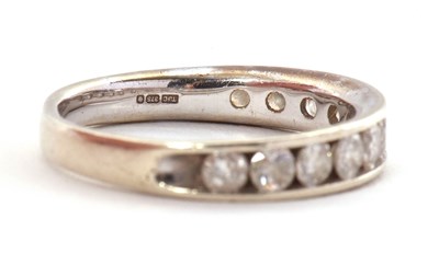 Lot 45 - A 9ct diamond ring, with channel set round...