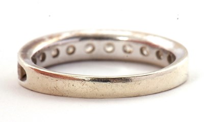 Lot 45 - A 9ct diamond ring, with channel set round...